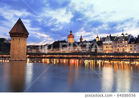 Chapel Bridge and Lucerne skyline at dusk, Switzerland Chapel Bridge and Lucerne skyline at dusk, Switzerland 64886056