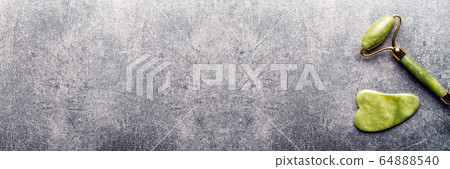 Jade face roller and Gua sha stone 64888540