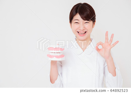 Female dentist dental care dental hygienist caries prevention whitening Female dentist dental care dental hygienist caries prevention whitening 64892523