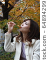 Beautiful Osaka woman eating model photo: Mitarashi Dango 64894299
