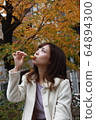 Beautiful Osaka woman eating model photo: Mitarashi Dango 64894300