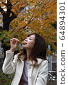 Beautiful Osaka woman eating model photo: Mitarashi Dango 64894301