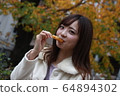 Beautiful Osaka woman eating model photo: Mitarashi Dango 64894302