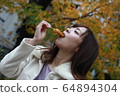 Beautiful Osaka woman eating model photo: Mitarashi Dango 64894304