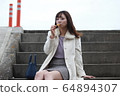 Beautiful Osaka woman eating model photo: Mitarashi Dango 64894307