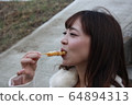 Beautiful Osaka woman eating model photo: Mitarashi Dango 64894313