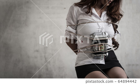 The woman was kidnapped as a hostage and tied to a 64894442
