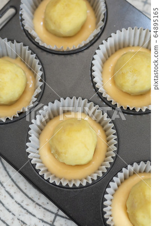 Making sweets at home Sweet potato muffins before baking 64895165