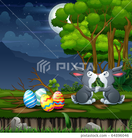 The Easter bunnies kissing with Easter eggs around him The Easter bunnies kissing with Easter eggs around him 64896046
