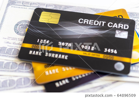Credit cards and 100 dollars in cash 64896509