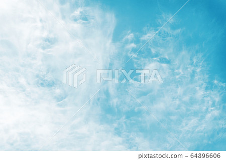 Blue sky and white thin cirrus clouds. Beautiful background and panorama. Blue sky and white thin cirrus clouds. Beautiful background and panorama. 64896606