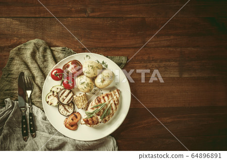 Fried chicken fillet and boiled vegetables Fried chicken fillet and boiled vegetables 64896891