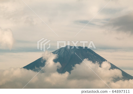 Close up of Mouth crater of Fuji san with many cloud around in Autumn season of Japan 64897311