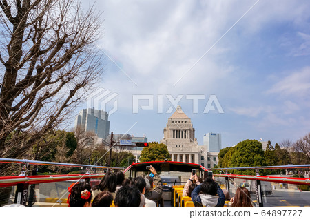 Parliament building seen from a sightseeing bus Parliament building seen from a sightseeing bus 64897727
