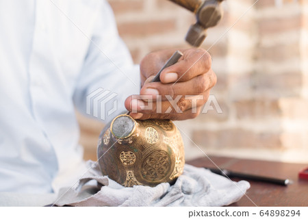 chaser of copper at work chaser of copper at work 64898294