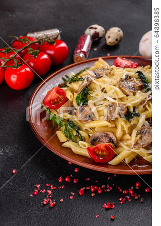 Pasta with mushrooms, cheese, spinach and rukkola Pasta with mushrooms, cheese, spinach and rukkola 64898385