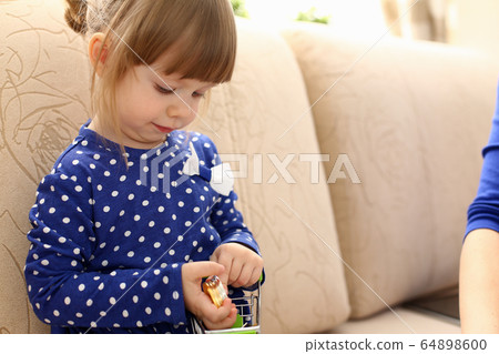 Little girl arm collecting crypto coins 64898600