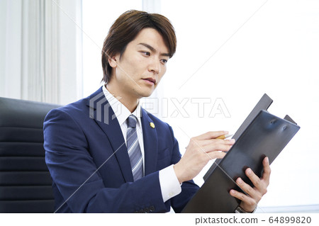 A young businessman A young businessman 64899820