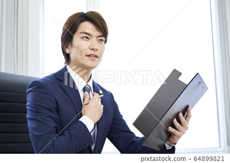 A young businessman A young businessman 64899821