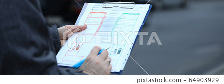 Person on street with paper folder Person on street with paper folder 64903929