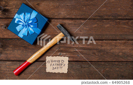 Happy Fathers Day gift box with tie, hammer, blue Happy Fathers Day gift box with tie, hammer, blue 64905268