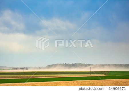 Dust storm in dry fields, dry weather infuenced by climate change 64906671