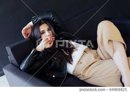 Beautiful fashionable oriental brunette woman in home clothes 64909825