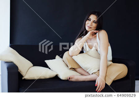 Beautiful fashionable oriental brunette woman in home clothes 64909829