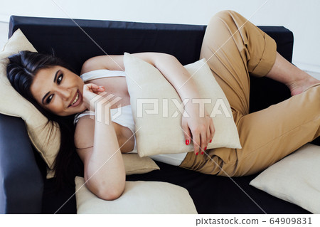 Beautiful fashionable oriental brunette woman in home clothes 64909831