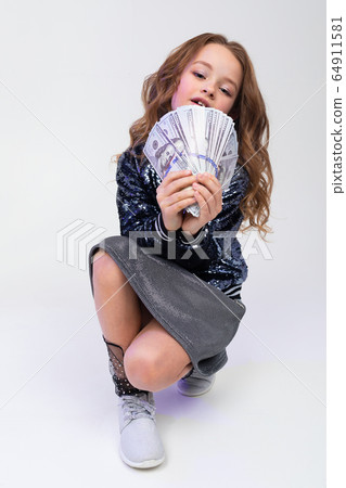 stylish girl with money bills on a white background 64911581