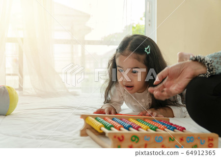 Little cute girl play education colorful toys with 64912365