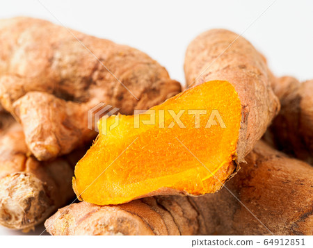 Turmeric root close up, white background 64912851