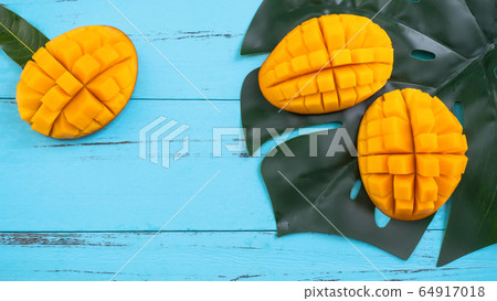Mango cut blue background Mango cut blue background 64917018