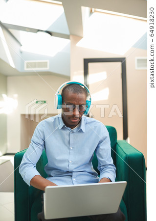 African man using laptop African man using laptop 64918230