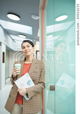 Young businesswoman at office Young businesswoman at office 64918235
