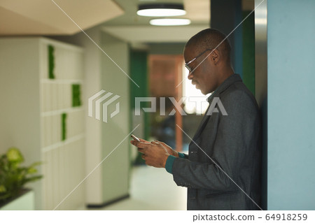Businessman working on the phone Businessman working on the phone 64918259