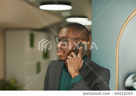 Businessman using mobile phone Businessman using mobile phone 64918263
