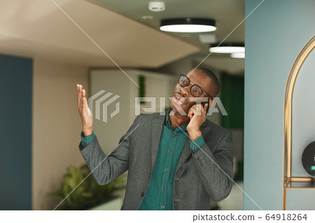 Businessman busy on the phone Businessman busy on the phone 64918264
