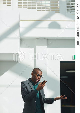 Businessman talking on the phone Businessman talking on the phone 64918267