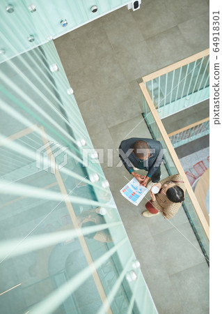 People discussing financial report 64918301