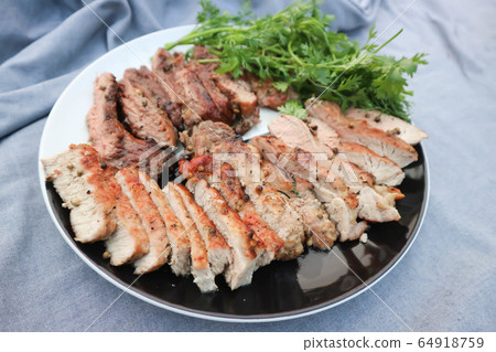 grilled pork , pork steak and beef steak 64918759