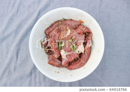 raw pork or sliced pork and raw beef 64918766