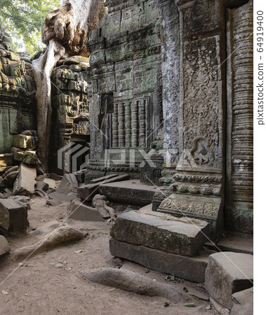 Ta Prohm Temple, Angkor Temple overgrown by massive trees after abandoned for centuries, Siem Reap, Cambodia Ta Prohm Temple, Angkor Temple overgrown by massive trees after abandoned for centuries, Siem Reap, Cambodia 64919400