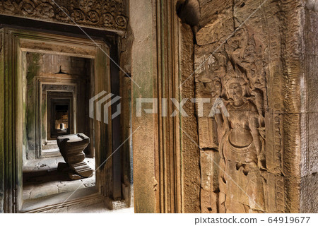 Apsara engraving on a wall inside Bayon Temple hallway, Angkor Thom, Siem Reap, Cambodia Apsara engraving on a wall inside Bayon Temple hallway, Angkor Thom, Siem Reap, Cambodia 64919677