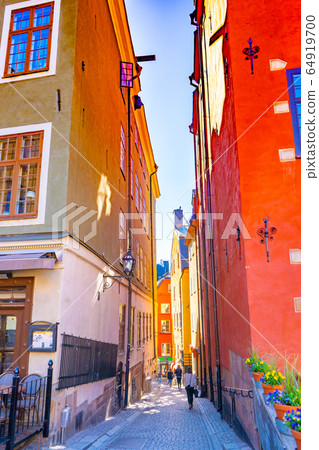 Narrow street in Stockholm. The old town (gamla stan) of the Swedish capital. Narrow street in Stockholm. The old town (gamla stan) of the Swedish capital. 64919700