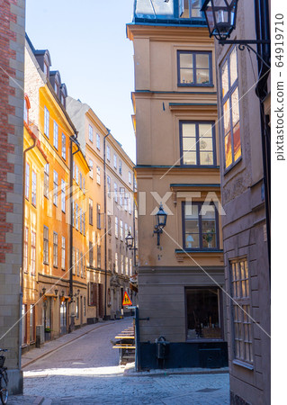 Narrow street in Stockholm. The old town (gamla stan) of the Swedish capital. Narrow street in Stockholm. The old town (gamla stan) of the Swedish capital. 64919710