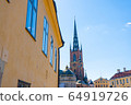 View with Riddarholm Church (Riddarholmskyrkan). Old town in Stockholm. 64919726