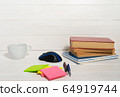 Home office concept. Work from home. Books and cafe cuo on the white wooden background. Side view 64919744