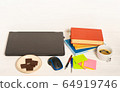 Home office concept. Work from home. Black laptop, books and cafe cuo on the white wooden background. Side view.  64919746