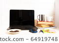 Home office concept. Work from home. Black laptop, books and cafe cuo on the white wooden background. Side view.  64919748